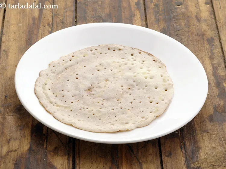 Step 33 – Remove in a plate and enjoy. Avoid stacking the <strong>poha dosa</strong> on top of each …