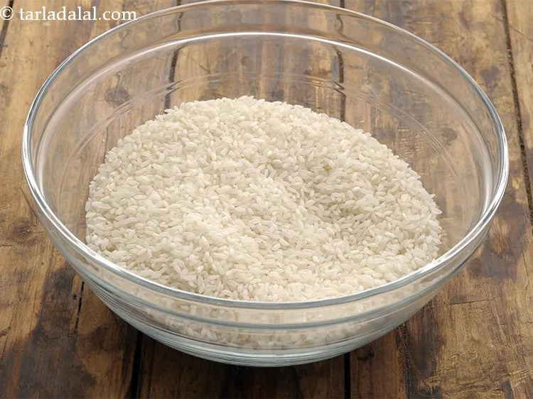 Step 6 – For preparing the batter of <strong>aval dosai</strong>, in a deep bowl take the rice.