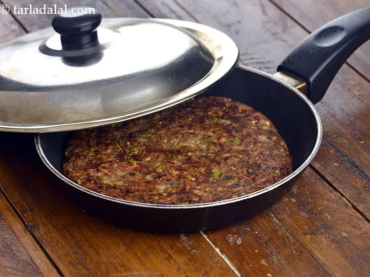 Step 44 – Pour a portion of the batter on it and spread it evenly, cover with a …