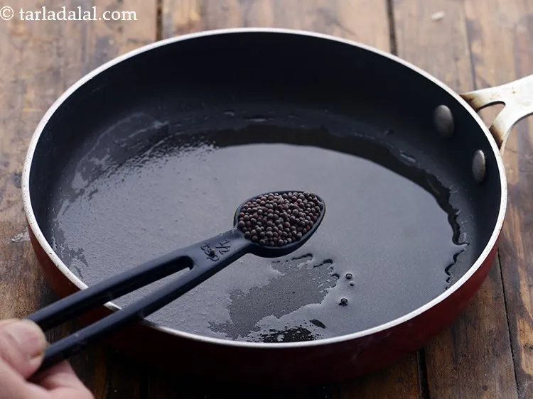 Step 35 – Add&nbsp;1 tsp&nbsp;<a href="https://www.tarladalal.com/glossary-mustard-seeds-sarson-rai-sarson-ke-beej-525i">mustard seeds ( rai / sarson)</a>.<br /> &nbsp;