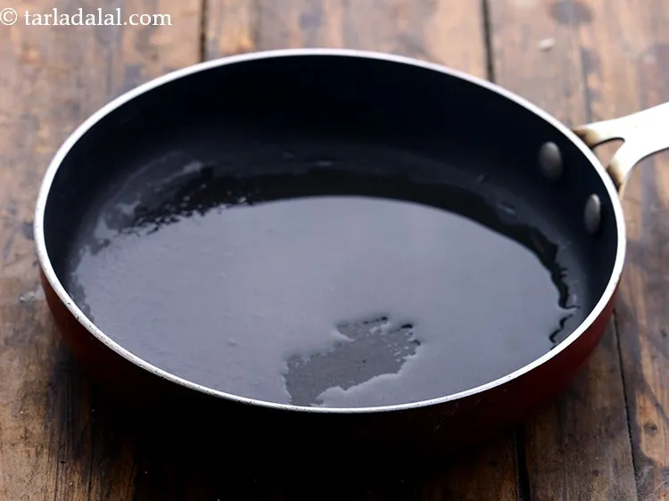 Step 34 – <strong>For the tempering for the batter of poha nachni handvo recipe | nachni handvo | …