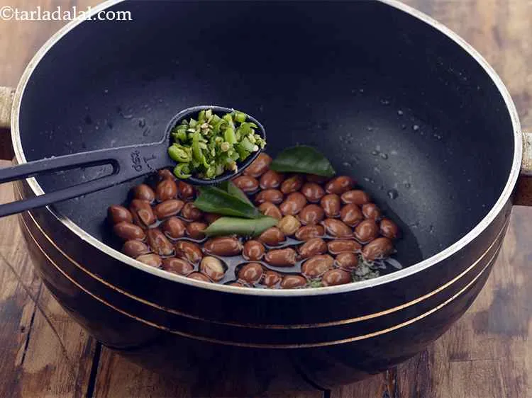 Step 6 – Add the curry leaves and finely chopped green chillies.