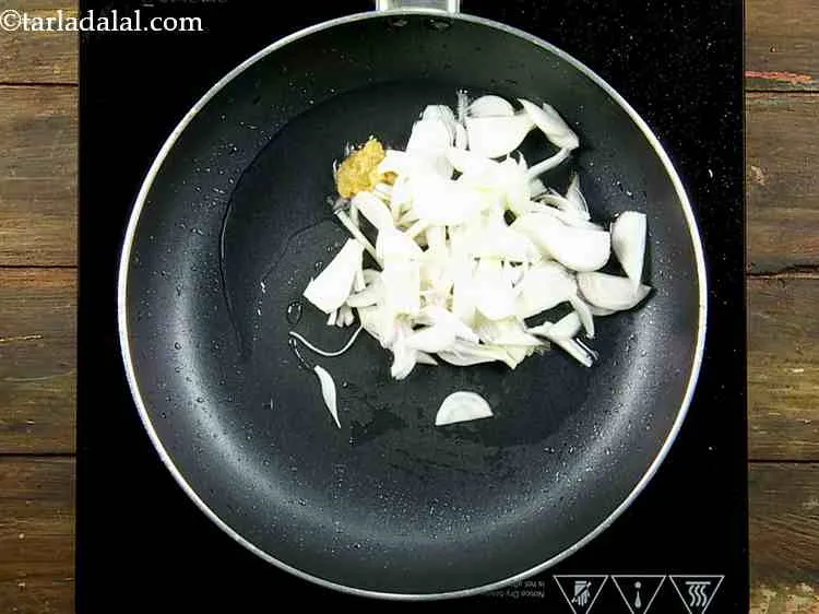 Step 7 – With this, add the spring onion whites.