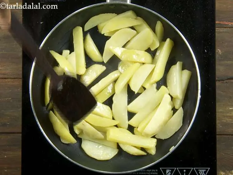 Step 2 – Add the potato fingers to the oil and mix well.&nbsp;