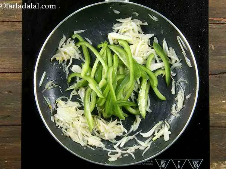 Step 9 – Add the sliced capsicums to the pan. The capsicums not only add color but also …