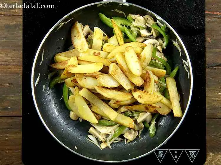 Step 11 – At this stage add the saut?ed potatoes.