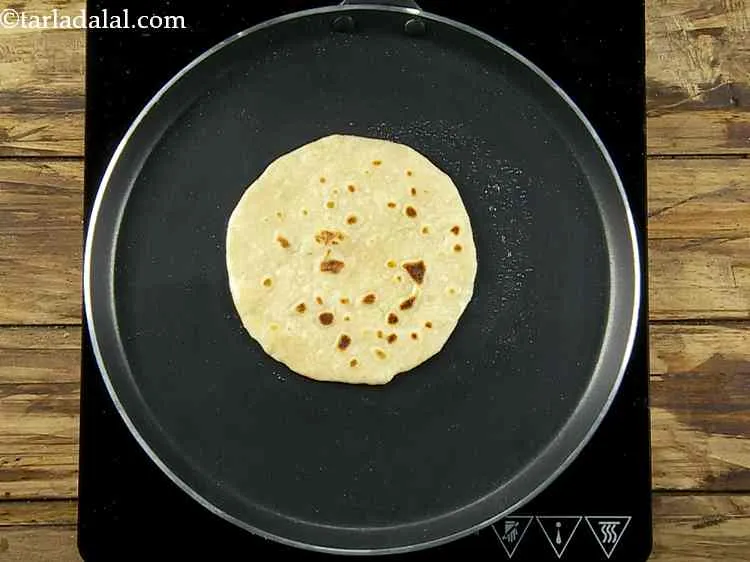 Step 9 – Heat a non-stick tava (griddle) and cook the roti using a little oil till golden …