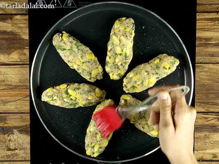 Step 20 – Place all the rolls onto the greased tava and cook those using 2 tsp oil.