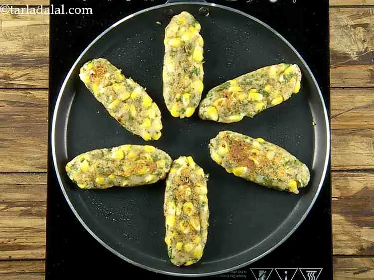 Step 21 – Flip them over and cook till they turn golden brown in color from both the …