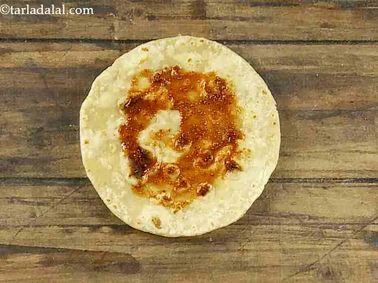 Step 27 – Apply a little masala water evenly over it.