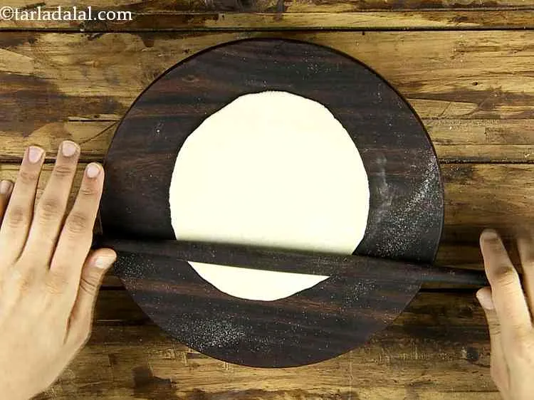 Step 8 – Roll the dough into a 125 mm. (5?) diameter circle using a little whole wheat …