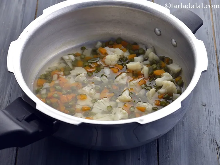 Step 34 – Open the lid of the pressure cooker. This is how cooked mixture for <strong>Potato and …