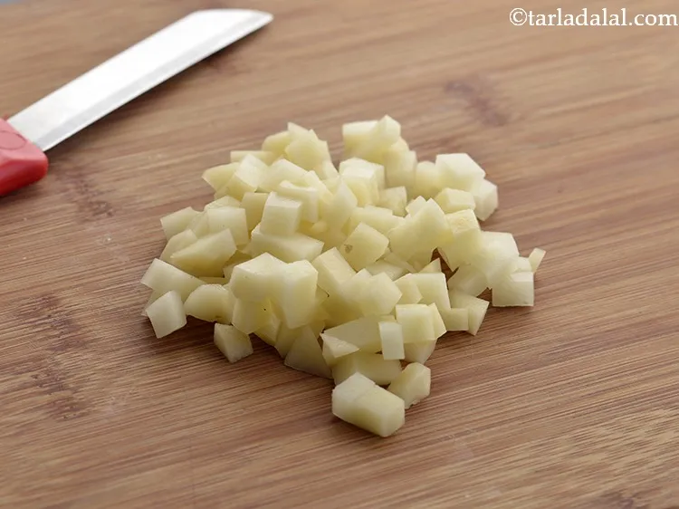 Step 12 – Using a sterilized knife chop the potatoes. Keep the chopped potatoes aside.&nbsp;&nbsp;