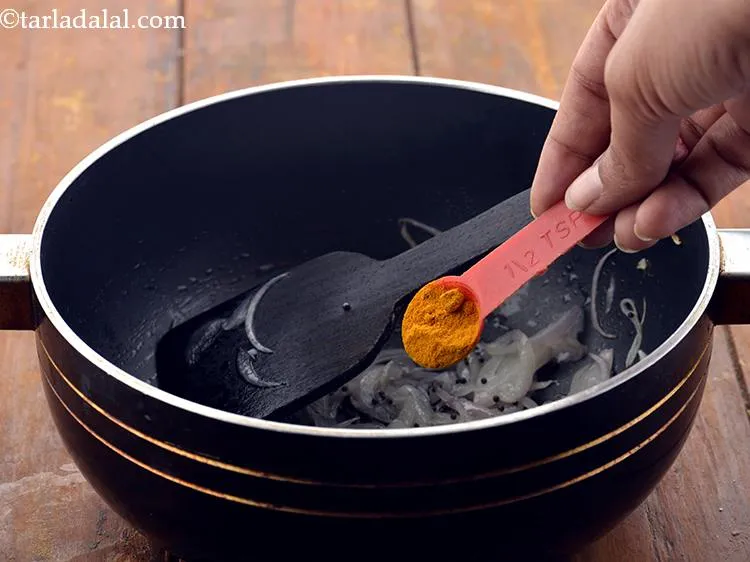 Step 10 – Add the turmeric powder.