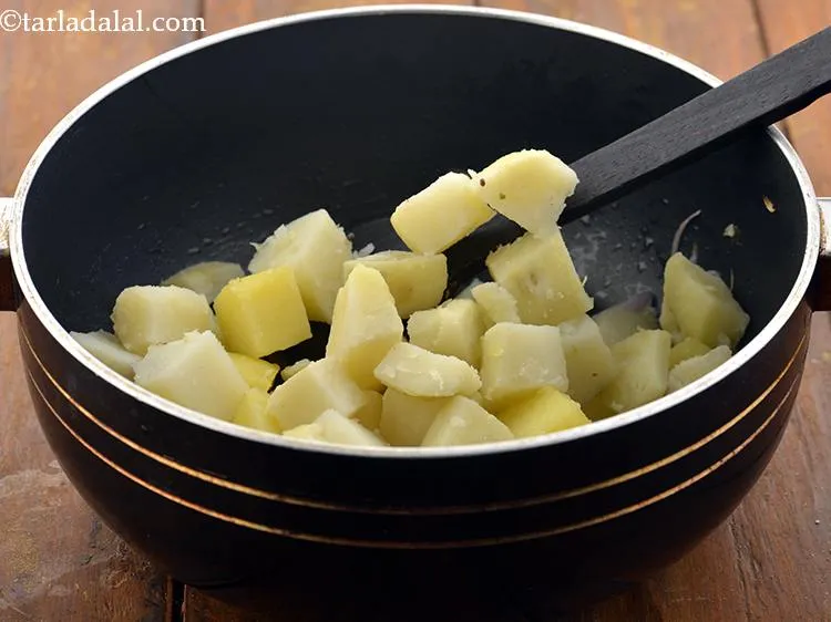 Step 11 – Add the potatoes. If you want a little mushy <strong>aloo bhaji</strong> then add around &frac14; …