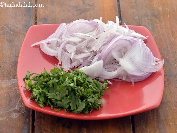 Step 4 – Also, we will chop onions &amp; coriander for the<strong> aloo bhaji</strong> and keep ready.