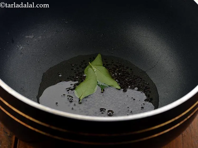 Step 7 – When the seeds crackle, add the curry leaves and saut&eacute; on a medium flame for …