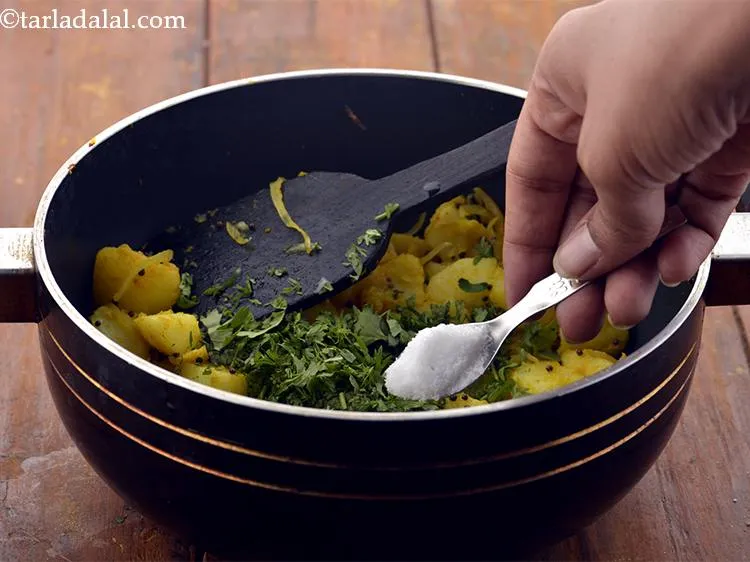 Step 15 – Finally, add the coriander and salt to the&nbsp;<strong>Potato Bhaji (Aloo Sabzi)</strong>&nbsp;.