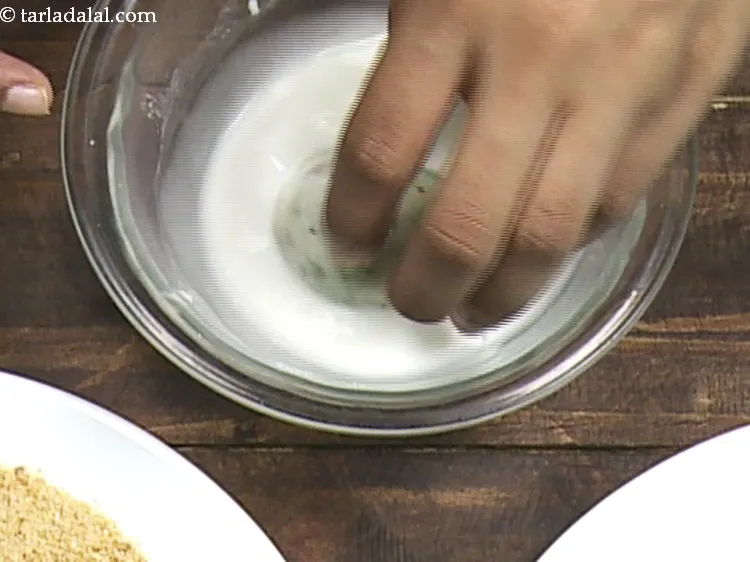 Step 18 – Dip a ball into the prepared cornflour water mixture.