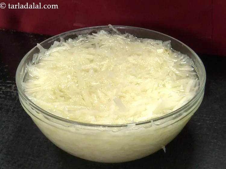 Step 27 – Also do not keep the grated potatoes in water for too long. They might turn …