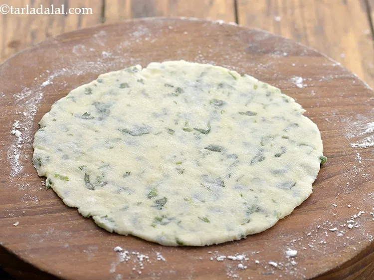 Step 13 – Roll out a portion of the dough into a 150 mm. (6&rdquo;) diameter circle with …