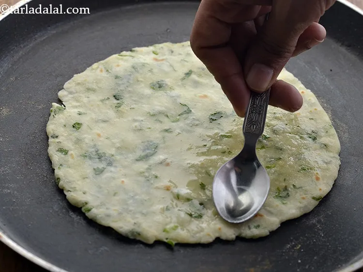 Step 15 – Apply 1/2 tsp of oil, flip and cook the other side.