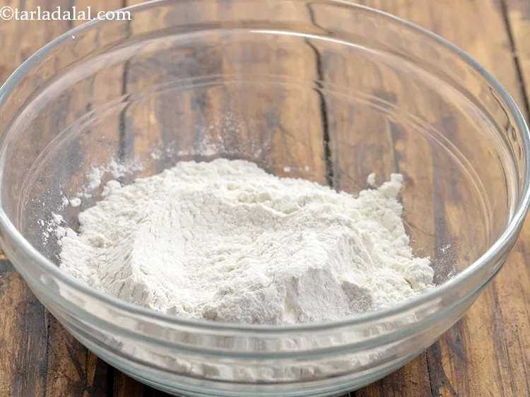 Step 3 – In a deep bowl, add refined flour.
