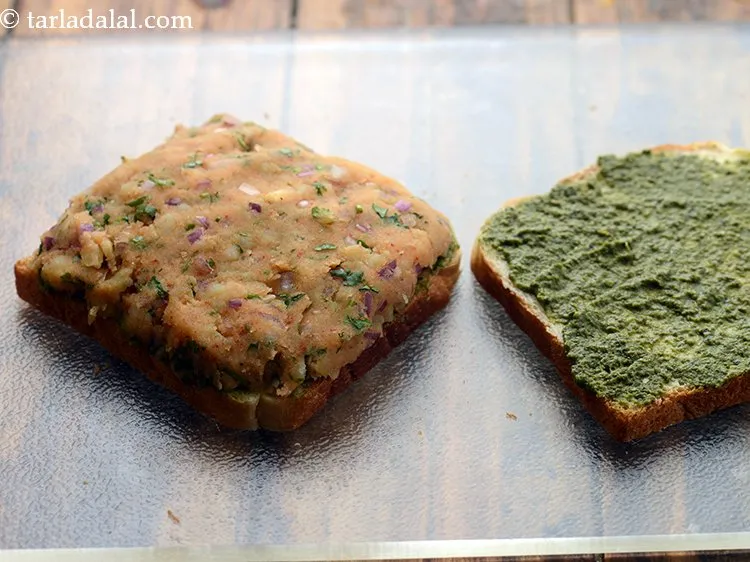 Step 13 – Put a portion of the stuffing on one buttered- chutney slice, spread it evenly.