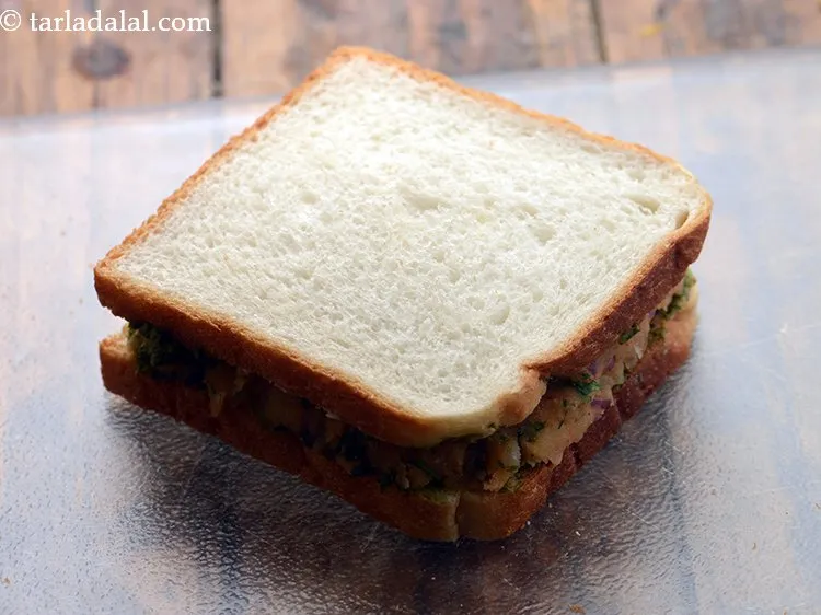 Step 14 – Sandwich it with another buttered-chutney slice facing downwards and press it lightly.