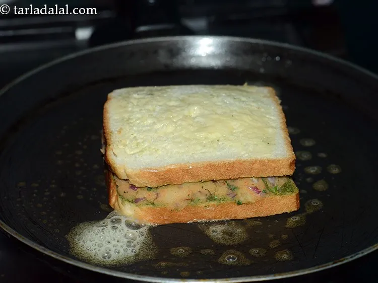 Step 17 – Place the prepared sandwich on it with the buttered side facing upwards.