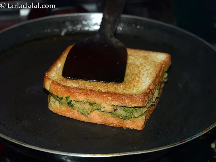 Step 18 – Cook on a medium flame till both sides turn crispy and golden brown in colour. …