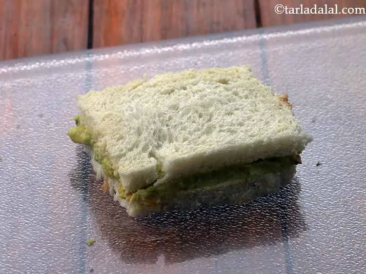 Step 15 – Cover it with another bread slice with the buttered side facing downwards.