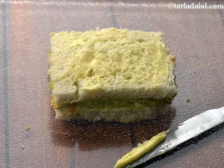 Step 16 – Spread ? tsp of butter evenly over it.