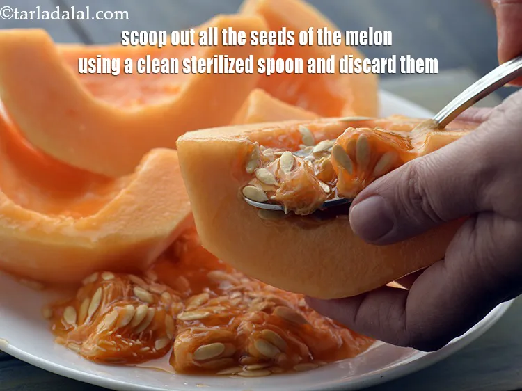 Step 8 – <meta charset="UTF-8" />Scoop out all the seeds of the melon using a clean sterilized spoon …