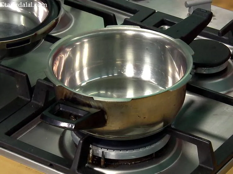Step 1 – To make <strong>Barely Water for Babies</strong>, first take a pressure cooker. &nbsp;