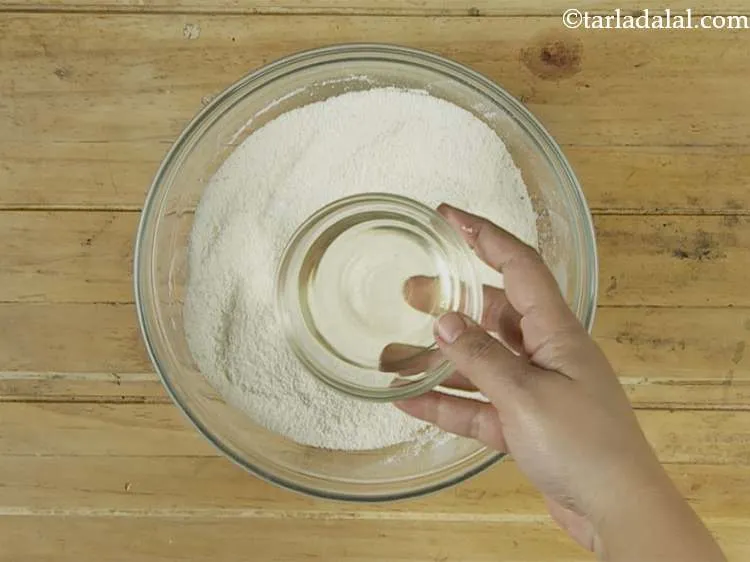 Step 4 – Add the oil. Oil coats semolina better than butter so, we use oil to make …