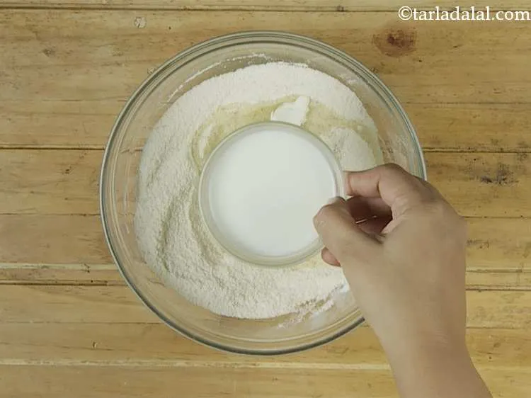 Step 6 – Add ? cup of milk. It provides a rich flavour and texture without using eggs.