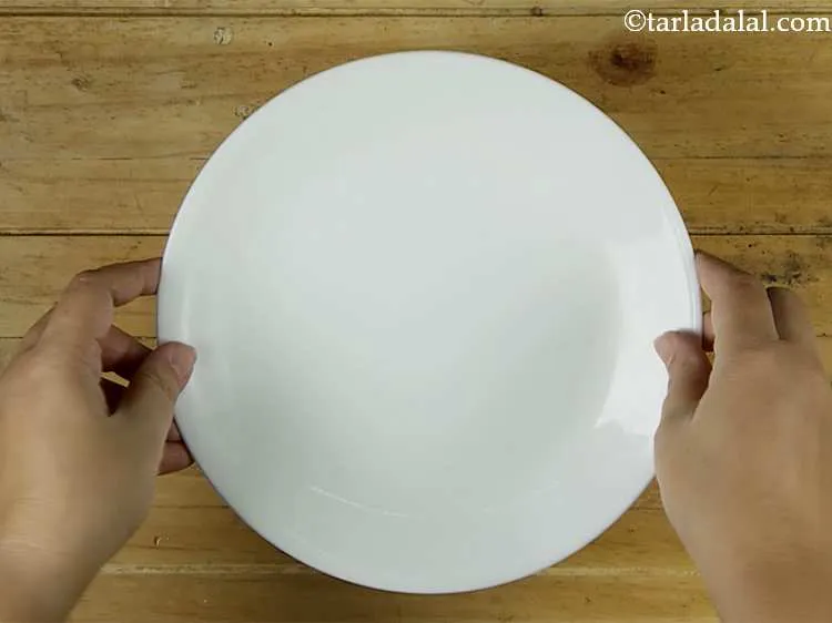 Step 8 – Cover the batter with a lid and keep aside for 15 minutes. The semolina absorbs …