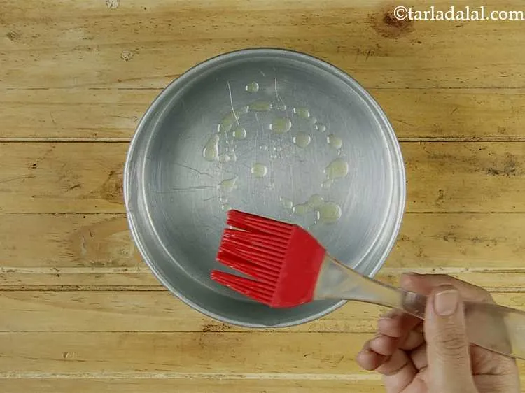 Step 11 – Grease a 150 mm. (6?) diameter aluminium cake tin using butter.