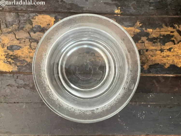 Step 11 – <meta charset="UTF-8" />To make&nbsp;<strong>pudina green tea</strong>, pour 1 cup of hot water in a glass …