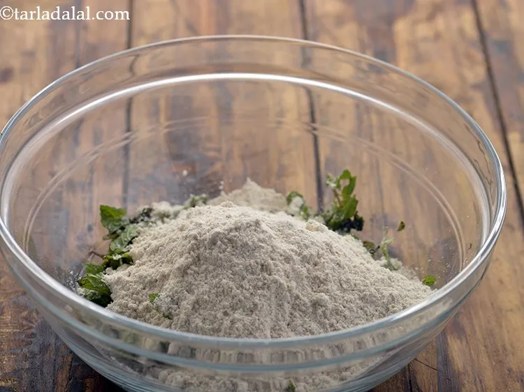 Step 7 – For making the dough of mint paratha, add whole wheat flour to the bowl.
