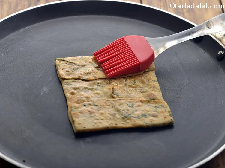 Step 22 – Using a little oil, cook the <strong>Pudina Paratha</strong> until you see golden brown spots on …