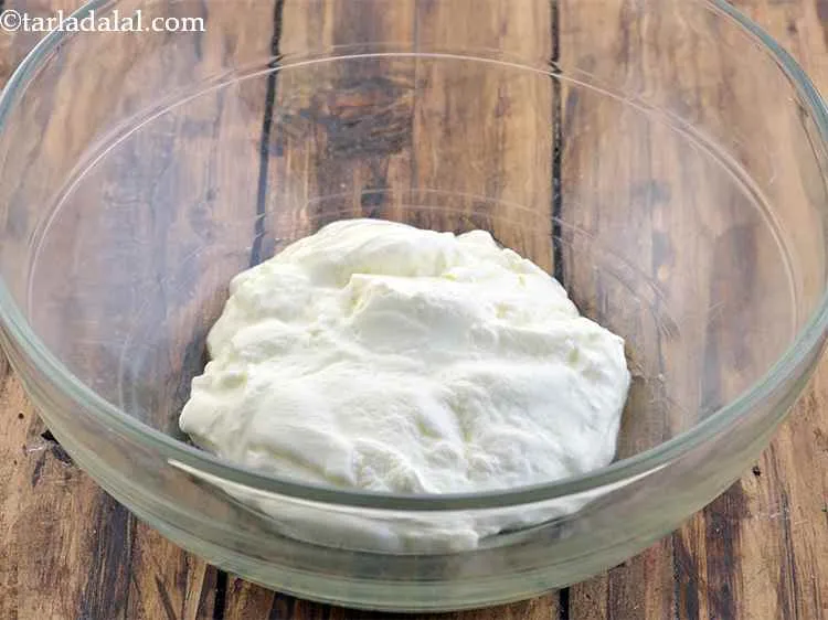 Step 6 – In a deep bowl, take thick curds. To learn how to make fresh dahi at …