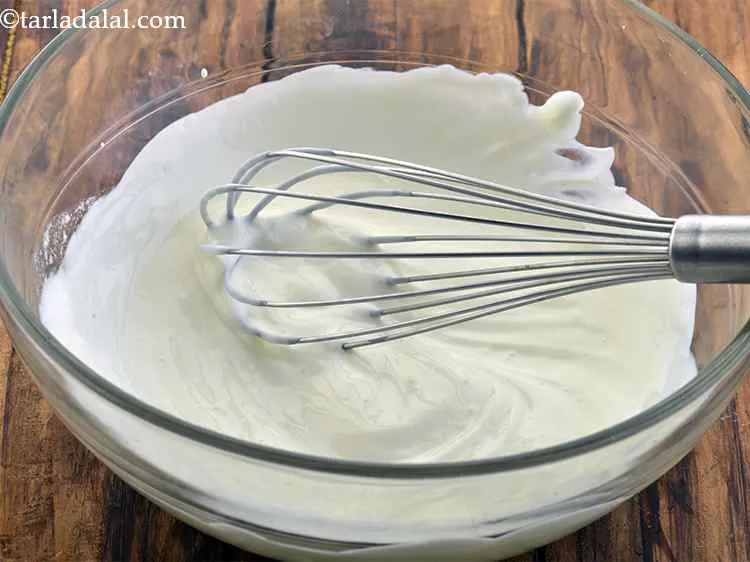 Step 7 – Whisk well so, the curd is lump-free and smooth.