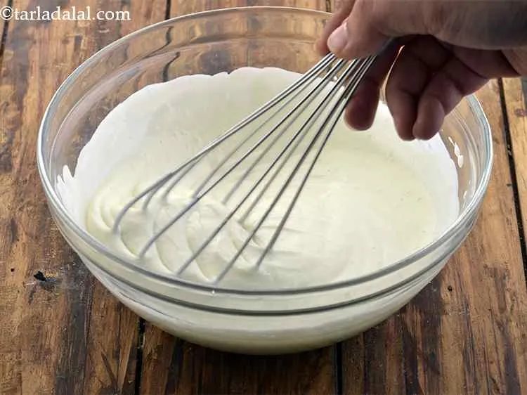 Step 7 – Whisk the curd till it is smooth.
