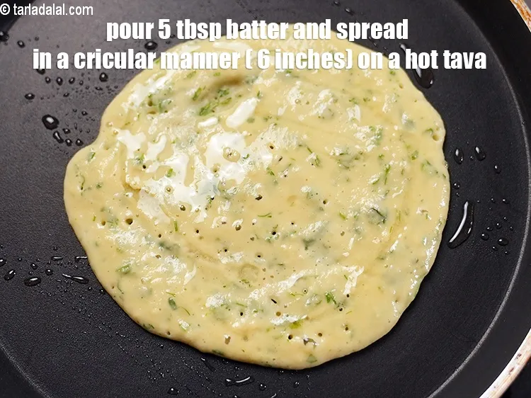 Step 45 – To make moong dal pudla, pour 5 tbsp batter and spread in a cricular manner …