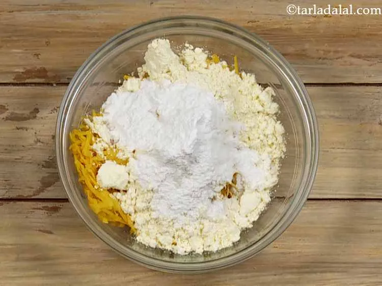 Step 3 – Then add rice flour which provides a very nice crispy texture to the kaddu pakodas …