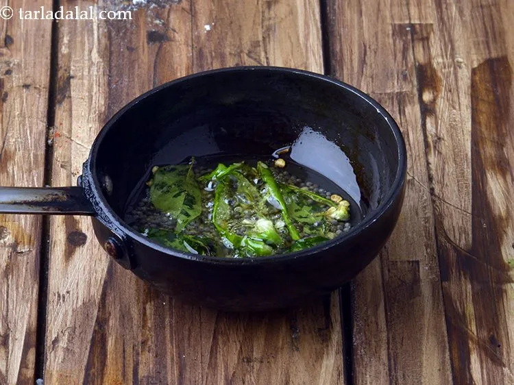 Step 15 – Add 1&nbsp;<a href="https://www.tarladalal.com/glossary-slit-green-chillies-1856i">slit green chilli</a>.&nbsp;Antioxidant&nbsp;<a href="https://www.tarladalal.com/recipes-for-Juices-Rich-in-Vitamin-C-805" target="_blank">vitamin C</a>&nbsp;in&nbsp;<a href="http://www.tarladalal.com/recipes-using-green-chillies-331">green chillies</a>&nbsp;protects the body from effects of …