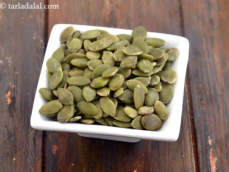 Step 11 – Sprinkle 1 tbsp&nbsp;<a href="https://www.tarladalal.com/glossary-pumpkin-seeds-pepitas-kaddu-ke-beej-857i">pumpkin seeds</a>&nbsp;evenly over it.