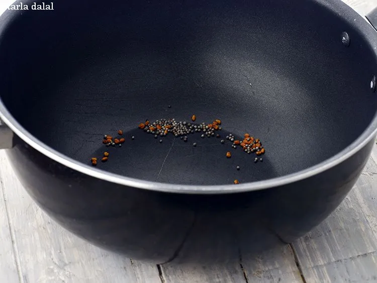 Step 34 – Heat a deep non-stick pan on a medium flame and when it is hot, add …